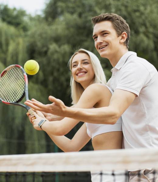active-couple-playing-tennis-together